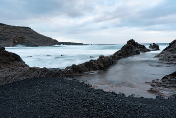 Waves crashing on rocks in El Golfo