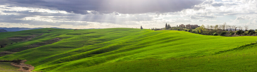 green fields and hills in Crete Senesi in Tuscany