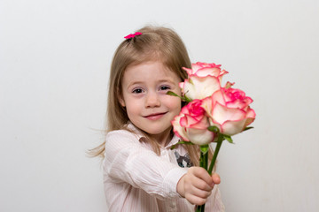 little girl with bouquet of roses