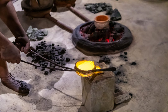 A blacksmith scene from stone age