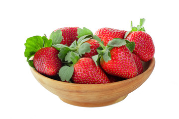 strawberries in wooden plate isolated on white