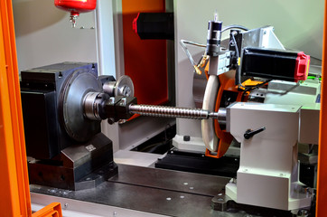 Metalworking CNC milling machine. Cutting metal modern processing technology. Small depth of field. Shooting in real conditions of work of the industrial machine