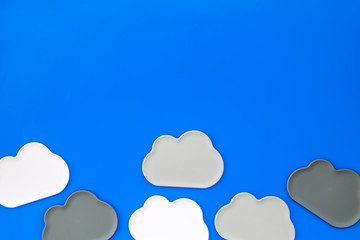 cloud computing concept with clouds on blue background top view space for text