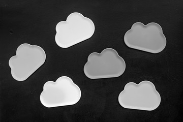 cloud computing concept with clouds on black background top view