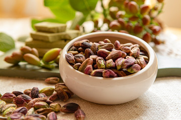 Sweet, delicate and fragrant nuts, Bronte pistachios with  brilliant green colour, ingredient for Italian cuisine, ice creams, cakes, pesto