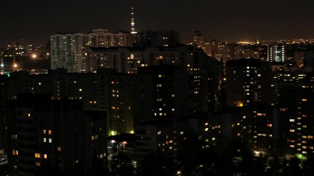 View of the night multi-storey houses. Lots of lights in the windows. Dormitory area.