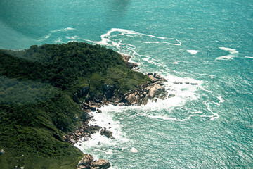 aerial view of sea and rocks on beach in Santa Catarina State, south of Brazil