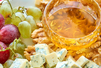 Cheese, grapes, walnuts and honey gourment assorted