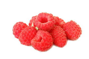 heap of red raspberries isolated on white background