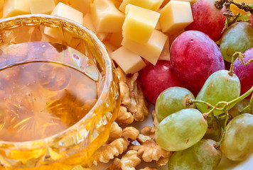 Cheese, grapes, walnuts and honey gourment assorted
