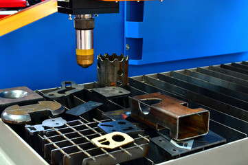 CNC Laser cutting of metal, modern industrial technology,  close-up. Shooting in real conditions, a slight blur of focus