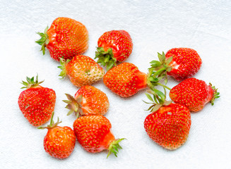 Strawberries on a white background, fresh, tasty and natural strawberries from the garden of his grandfather.