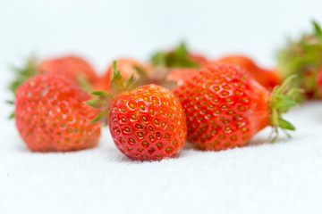 Strawberries on a white background, fresh, tasty and natural strawberries from the garden of his grandfather.