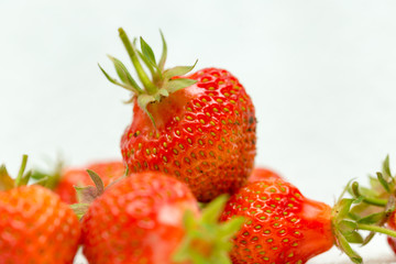 Strawberries on a white background, fresh, tasty and natural strawberries from the garden of his grandfather.