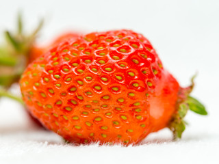 Strawberries on a white background, fresh, tasty and natural strawberries from the garden of his grandfather.