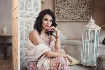 Fototapeta premium Woman posing in traditional morrocan living room