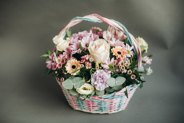 Fototapeta na wymiar bouquet of flowers in a wooden basket