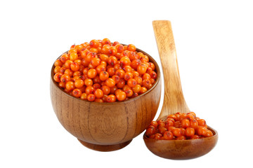 sea bucktorn in wooden spoon and in wooden cup isolated