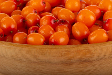 sea buckthorn in wooden cup