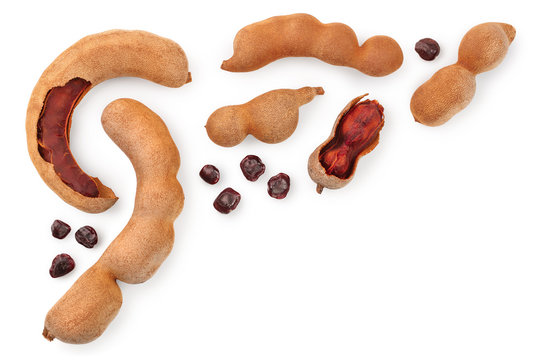 Tamarind fruit with seed isolated on white background with copy space for your text. Top view. Flat lay