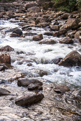 water racing through rocks to Guarau River in Peruibe, Brazil