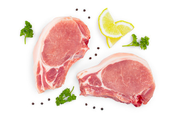 sliced raw pork meat with parsley and lemon isolated on white background. Top view. Flat lay