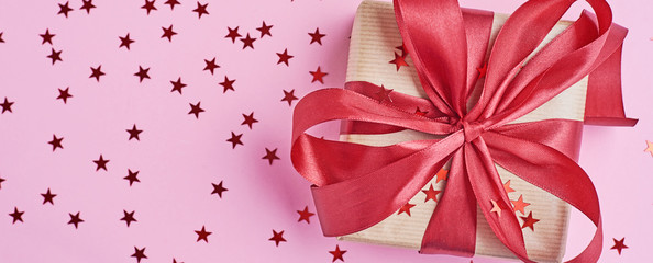 Gift box with bow and confetti, web banner