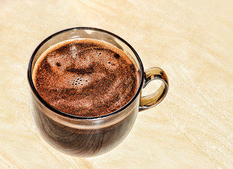 Fragrant coffee in a glass cup.