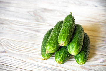 Fresh organic cucumber on the wooden table