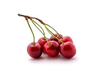 Photo of red cherries isolated on white background