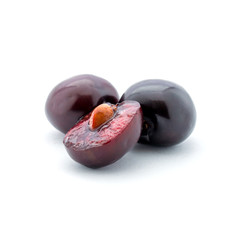Photo of dark red cherry isolated on white background