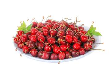 heap of red cherry in plate isolated