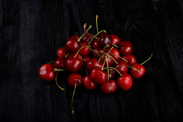 heap of cherry on wooden background