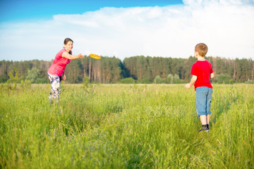 Mom and son play frisbee, Chernigov, Ukraine, May 30, 2019.