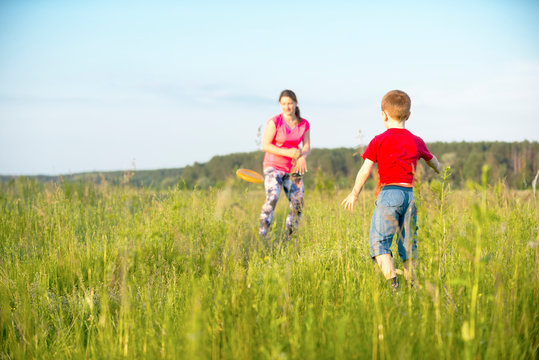 Mom and son play frisbee, Chernigov, Ukraine, May 30, 2019.