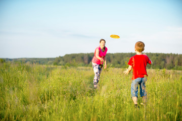Mom and son play frisbee, Chernigov, Ukraine, May 30, 2019.