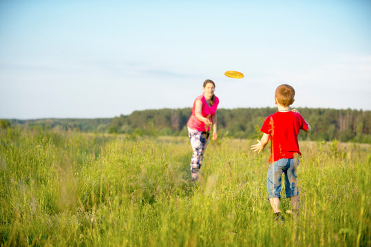 Mom and son play frisbee, Chernigov, Ukraine, May 30, 2019.
