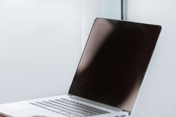 close up. businessman with laptop standing in the office.