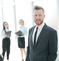 Fototapeta premium successful business couple on the background of a bright office