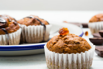 chocolate cupcakes, old white wooden table