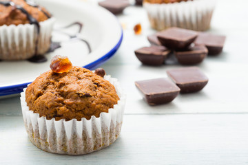 chocolate cupcakes, old white wooden table