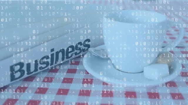 Cup of coffee and rolled newspaper