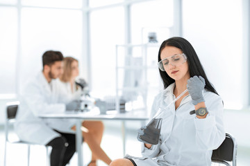 Fototapeta premium close up.woman scientist takes a sample of the liquid .