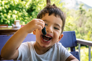 Kid eating mulberry