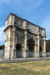 Fototapeta na wymiar Arch of Constantine near Colosseum in city of Rome, Italy