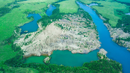 Blue lake. Sand dunes. Green lake. Blue sky and clouds.