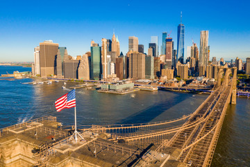 Brooklyn Bridge in New York City at dawn. Epic sunset view over Manhattan.