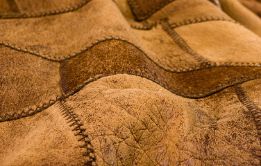 Old vintage genuine soft brown leather texture background, top layer with pores and scratches,...