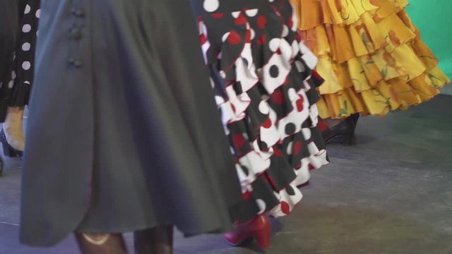 Spain - Flamenco. Women in traditional dresses dancing flamenko.