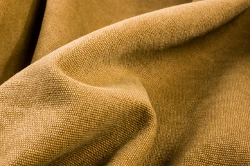clothing items stonewashed cotton fabric texture with seams, clasps, buttons and rivets, macro